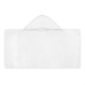 May include: A white hooded towel, ideal for use after swimming or bathing. The towel is rectangular with a triangular hood at the top. The material appears to be soft and absorbent, perfect for drying off.