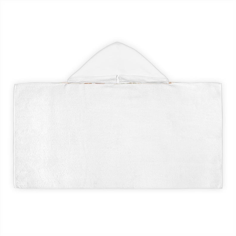 May include: A white hooded towel, ideal for use after swimming or bathing. The towel is rectangular with a triangular hood at the top. The material appears to be soft and absorbent, perfect for drying off.