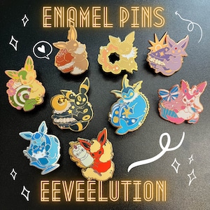 May include: A collection of enamel pins featuring various Eevee evolutions. Each pin showcases a unique design with vibrant colors and intricate details. The pins are set against a dark background, with the words "ENAMEL PINS" and "EEVEELUTION" in gold.