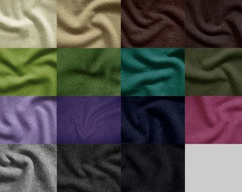 Pode incluir: Uma coleção de 15 amostras de tecido em várias cores, incluindo bege, verde, roxo, azul, rosa, cinza e preto. O tecido é texturizado e tem uma aparência macia e felpuda.