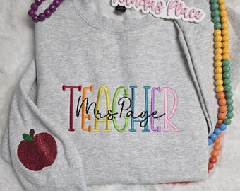 Sudadera personalizada para profesor: nombre bordado y detalle de manzana