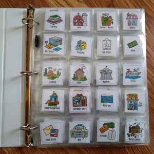 May include: A clear binder with colorful picture cards inside. Each card has a picture of a place, such as a library, farm, farmer's market, bakery, rec center, shopping, eye doctor, bank, camping, cabin, museum, cruise, indoor playground, hardware store, aquarium, toy store, post office, mall, errands, and nature center.