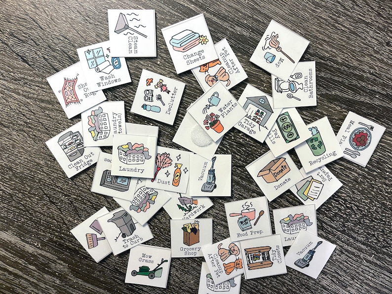 May include: A set of colourful square chore cards with illustrations and text. The cards include chores such as laundry, vacuuming, cleaning the bathroom, and paying bills.