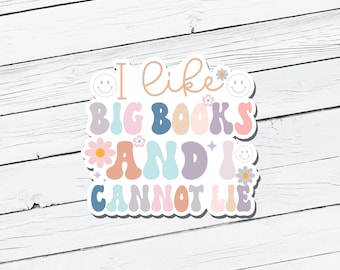 May include: A sticker with a colorful, retro-style font that reads "I like big books and I cannot lie". The sticker features a smiley face, flowers, and a star.