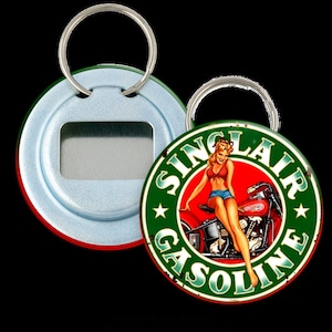 May include: A round metal keychain with a bottle opener on one side and a vintage Sinclair Gasoline logo with a pin-up girl on a motorcycle on the other side.