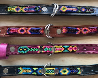 May include: Six leather collars arranged horizontally, each featuring a central woven textile strip with geometric patterns in vibrant colors like neon green, pink, blue, and yellow, secured with silver-toned metal hardware and D-rings.