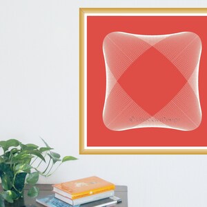 May include: A framed art print featuring a geometric design. The artwork has a red background with a white, symmetrical, abstract shape in the center. The frame is gold-colored, and the print is hanging on a white wall.
