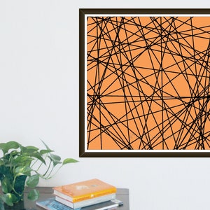 May include: Abstract art print with a network of black lines on an orange background. The artwork is framed in a dark brown frame and is displayed on a white wall. The image is a modern, geometric design.