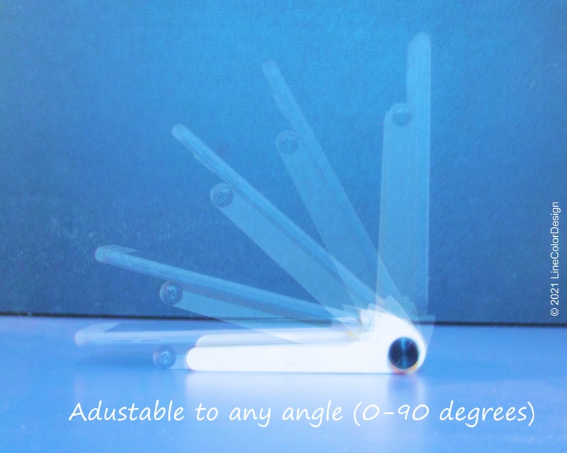May include: White adjustable phone stand with a blue accent, shown at various angles against a blue background. The stand is designed to adjust from 0 to 90 degrees. Text on the image reads: "Adustable to any angle (0-90 degrees)".