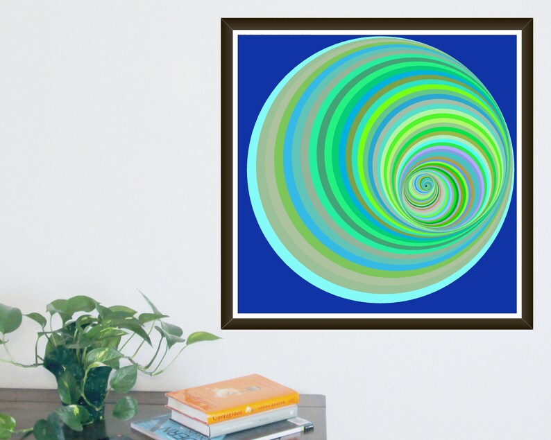 May include: Abstract art print featuring a spiral design in shades of green, blue, and yellow on a deep blue background. The artwork is framed in a dark brown frame and is displayed on a white wall. The artwork is a modern piece of art.