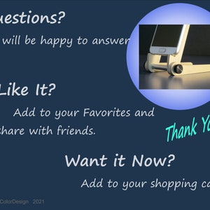 May include: A white and silver phone stand with a smartphone in place, set against a dark blue background. Text includes "Questions?", "Like It?", "Want it Now?", and "Thank You!"