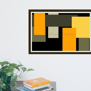 May include: Abstract art print featuring a geometric design with rectangular shapes in shades of orange, yellow, olive green, and black. The artwork is framed in a dark brown frame and includes the text "Line Color Design".