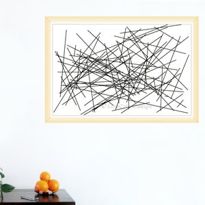 May include: Abstract art print with a pattern of black lines on a white backdrop, set within a light beige wooden frame. This modern minimalist design is suitable for various interior styles. The artwork is a contemporary piece.