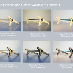 May include: Image showcasing various wooden laptop stands with different finishes and bar colors. Options include natural birch wood and black stain wood, paired with silver, black, or blue anodized bars. Text reads "Wood Finishes and Colors Available at Checkout."