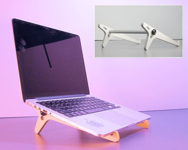 May include: A laptop computer resting on a wooden stand. The stand is angled to elevate the laptop. The stand is made of light-colored wood and has a simple, modern design. An additional image shows a silver metal laptop stand.