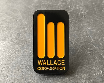 May include: Black and yellow enamel pin with three vertical bars and the text "WALLACE CORPORATION".