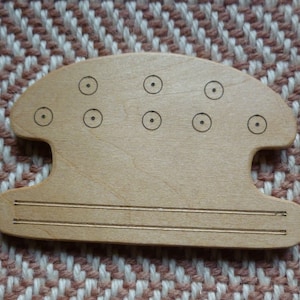 Flätvävningsskyttelreplika av 700-talsfynd från Chalton, Hampshire