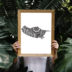 May include: A framed print of a black and white illustration of the island of Madeira, Portugal. The illustration is filled with intricate patterns and designs.