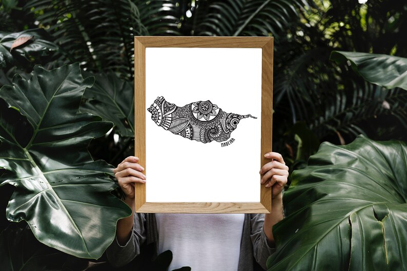 May include: A framed print of a black and white illustration of the island of Madeira, Portugal. The illustration is filled with intricate patterns and designs.