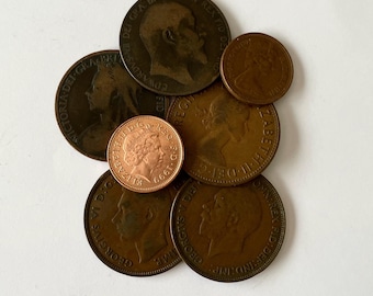 7 British One Penny Coins Featuring 5 Monarchs (1899–1999)