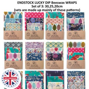 May include: A set of three beeswax food wraps in various patterns and colors, including floral, leaf, and koi fish designs. Each set includes sizes of 30, 25, and 20 cm. The wraps are secured with a brown paper band labeled Honey Bee Good.