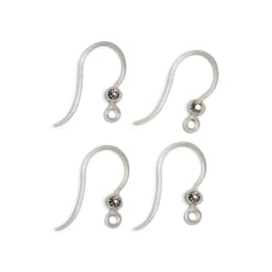 May include: Four silver-toned earring hooks, each featuring a curved wire ear wire, a small decorative bead, and a circular loop at the bottom for attaching jewellery components. These metal findings are designed for creating custom earrings.