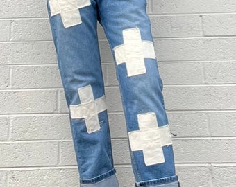 Cream cross jeans, festival jeans, vintage patches, upcycled jeans, boho cross patch hippie fashion ,