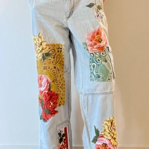 Upcycled wide leg patched denim jeans with cargo pockets, embellished with bandanna, fabric, magnolia flowers, and cherries. one of a kind,