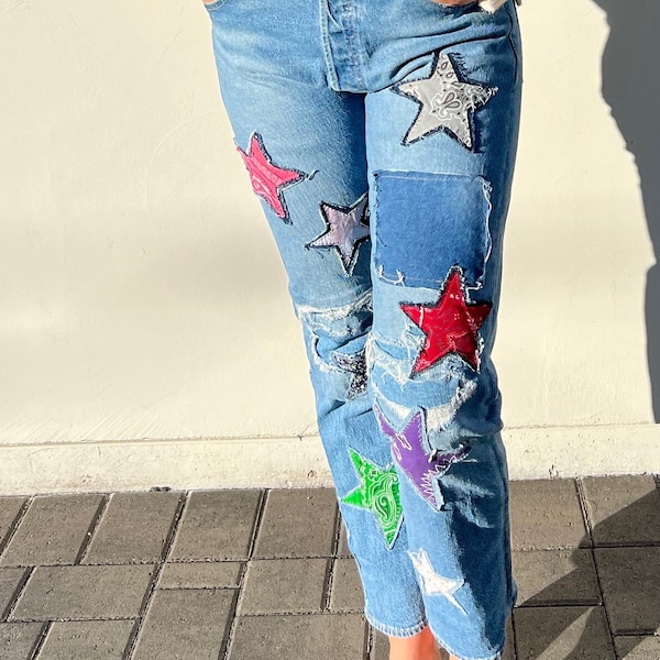 Patched and distressed jeans, festival jeans, vintage patches, upcycled jeans, boho star patch hippie fashion , free people inspire