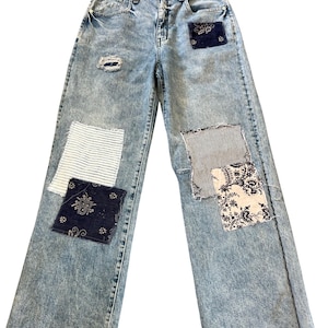 Patched upcycled Pilcro brand jeans size 28, distressed denim with patches
