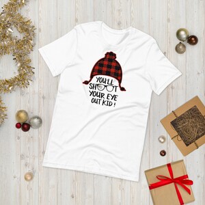 Ti sparerai gli occhi, Natale, T-shirt unisex con storia di Natale