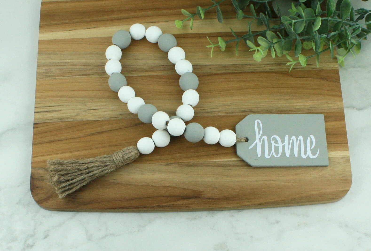 Wooden Bead Garland With Tassel, Farmhouse Beads for Coffee Table, Gifts  for Home Boho Chic Decor, Coastal Wood Bead Garland, Flat Lay Photo 