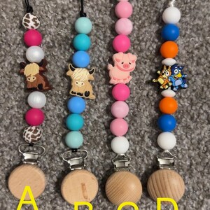 animal/ binky clips/ bluey/ cartoon/ cows/ fuzzy cows/ pink/ cute/ baby's/ toddlers/ pacifier clips/ baby shower gift