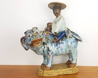 Chinese SHIWANZHEN Shiwan w/ Luohan Figure riding Foo Lion / Guardian. Blue-to-purple Flambe Crystalline Glaze, Guangdong, Antique 19th C.