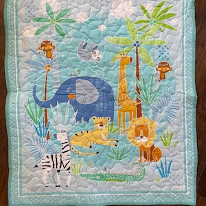 Aqua colored jungle animals kids quilted blanket