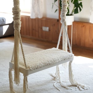 Adult swing. Indoor swing. Swing for adults and kids. Wooden swing. Home decoration. Beautiful and comfortable indoor swing.