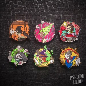 May include: Six enamel pins featuring various spooky characters. The pins are colorful and feature a witch, a vampire, a ghost, a creature with a spider web, a woman with a noose, and a woman driving a car. The pins are all circular and have a black outline.