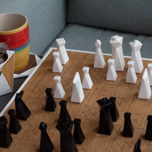 Modern geometric handmade resin chess pieces, elegantly weighted for balance and style. Unique designs perfect for board games, home decor, or a luxury personalized gift. Chessboard not included. Sleek, minimalist aesthetic ideal for any interior.
