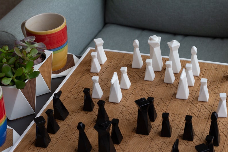Modern geometric handmade resin chess pieces, elegantly weighted for balance and style. Unique designs perfect for board games, home decor, or a luxury personalized gift. Chessboard not included. Sleek, minimalist aesthetic ideal for any interior.