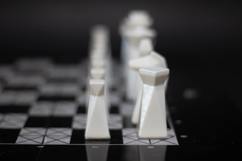 Modern geometric handmade resin chess pieces, elegantly weighted for balance and style. Unique designs perfect for board games, home decor, or a luxury personalized gift. Chessboard not included. Sleek, minimalist aesthetic ideal for any interior.