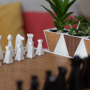 Modern geometric handmade resin chess pieces, elegantly weighted for balance and style. Unique designs perfect for board games, home decor, or a luxury personalized gift. Chessboard not included. Sleek, minimalist aesthetic ideal for any interior.