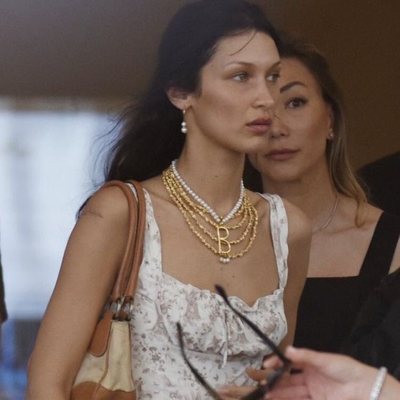 bella hadid gold necklace dress Bella Hadid in jaw-dropping outfit on Cannes red carpet