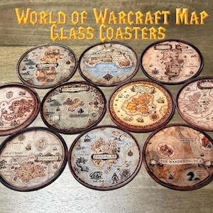 May include: A collection of ten glass coasters featuring maps from the World of Warcraft game. Each coaster has a unique map design with brown and beige tones, and a dark brown border. The text "WORLD OF WARCRAFT MAP GLASS COASTERS" is at the top.