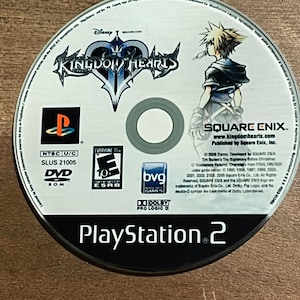 May include: A Kingdom Hearts PlayStation 2 DVD-ROM disc. The disc features the game's logo, a character illustration, and the PlayStation 2 logo. The disc is rated "E10+" by the ESRB.