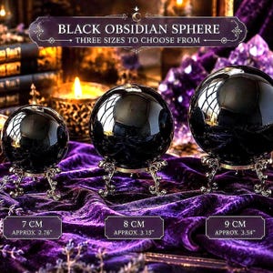 May include: Three polished black obsidian spheres displayed on ornate silver-toned metal stands. The spheres are labelled with sizes of 7 cm (2.76 inches), 8 cm (3.15 inches), and 9 cm (3.54 inches). The text reads Black Obsidian Sphere.