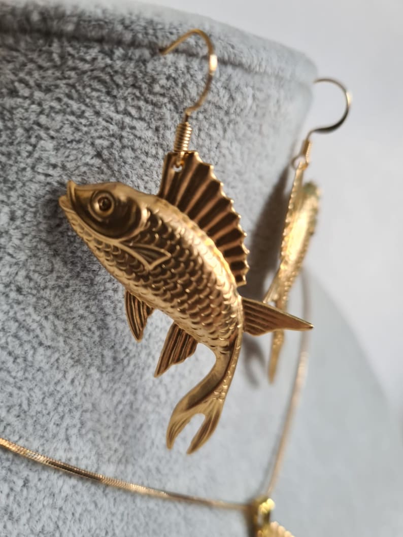 set necklace and earrings of golden fish charms
