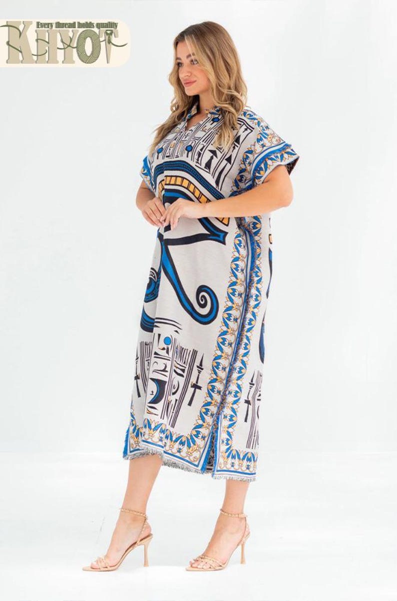 May include: A knee-length, short-sleeved dress with an Egyptian-inspired print in white, blue, black, and gold. The dress features a V-neck and a decorative border along the edges. The text "Every thread holds quality" is visible.