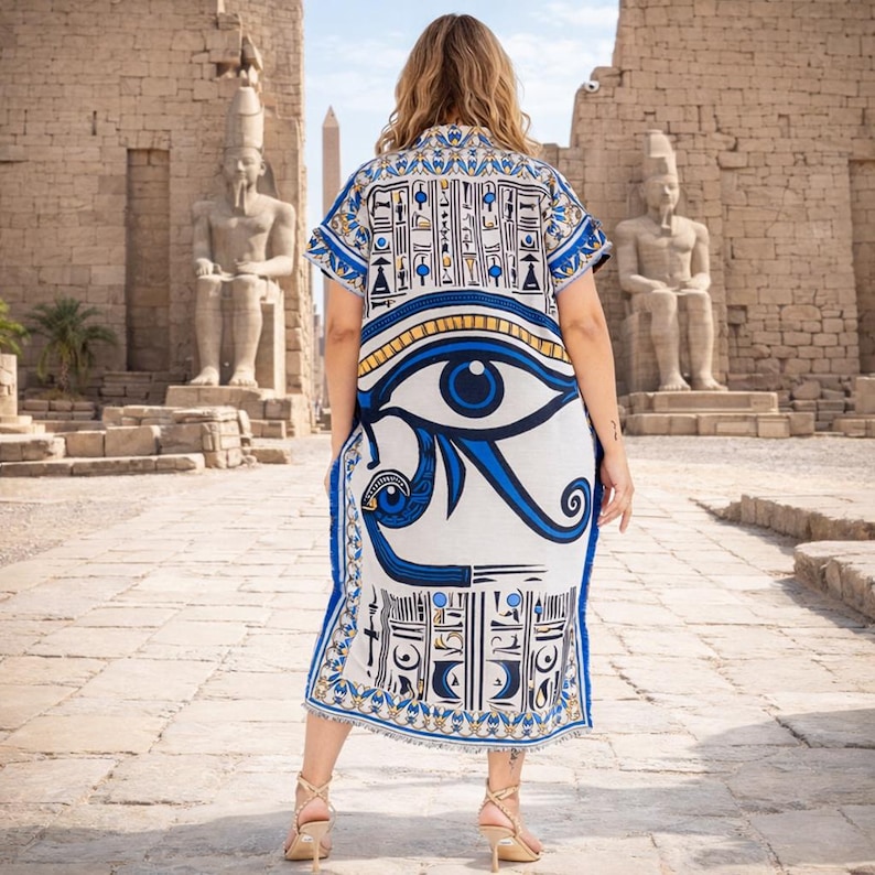 Back and partial side view of boho kaftan dress with striking Eye of Horus print and geometric motifs