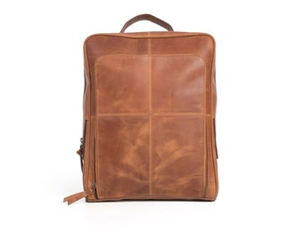 May include: A brown leather backpack with a zipped closure and a top handle.