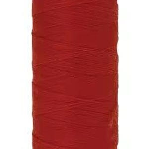May include: A spool of vibrant red sewing thread with a bright orange plastic top and bottom cap. The top cap features the text Mettler, while the bottom cap displays the text Polyester No. 100 150m/164yds. The thread is wound tightly around the spool.